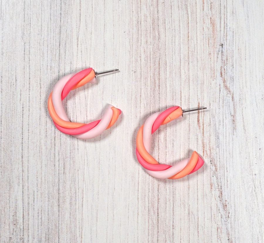 Intricate oven-baked clay jewelry pieces including pendants and necklaces
